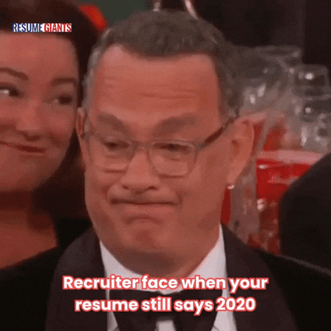 A recruiter reads a resume and reacts with disappointment